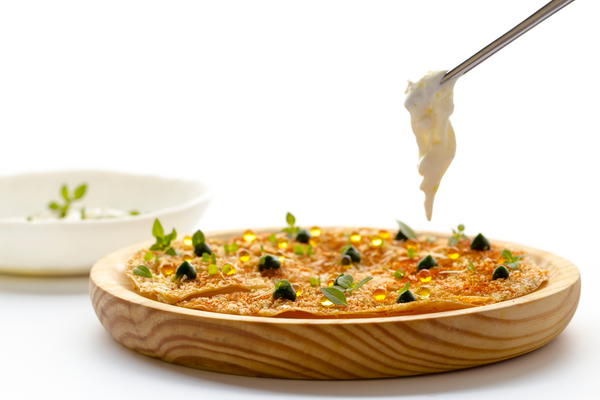 Pizzetta finished with Mozzarella cream, Caviaroli Basil and Caviaroli Chili